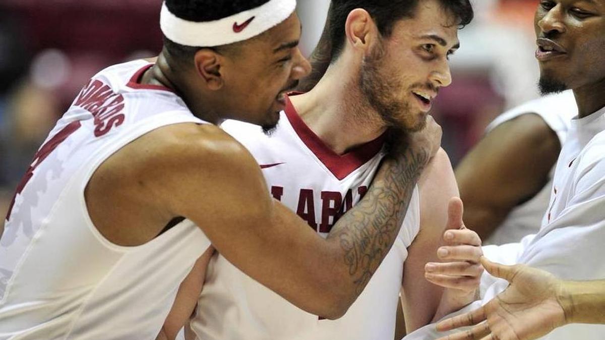Alabama forward Riley Norris (1) is congratulated after a three-pointer over the South Carolina Gamecocks during the first half of an NCAA college basketball game, Wednesday, Jan. 13, 2016, in Tuscaloosa, Ala.