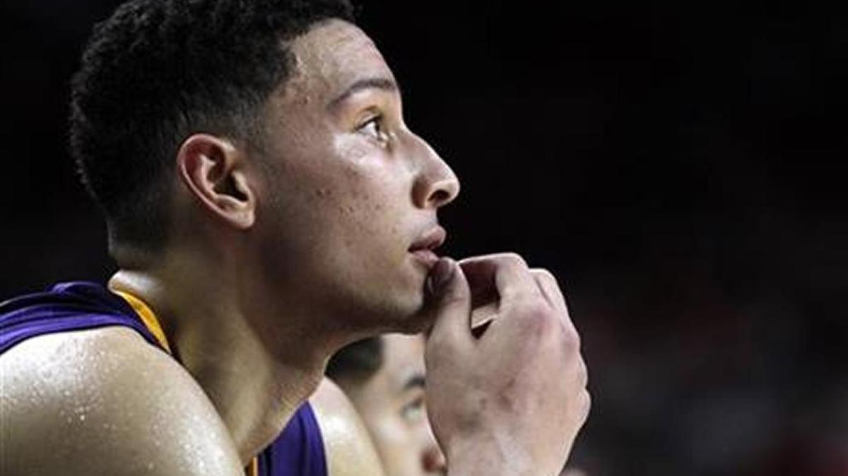 LSU's Ben Simmons watches from the bench with minutes left in an NCAA college basketball game against Arkansas, Tuesday, Feb. 23, 2016, in Fayetteville, Ark. Arkansas won 85-65.