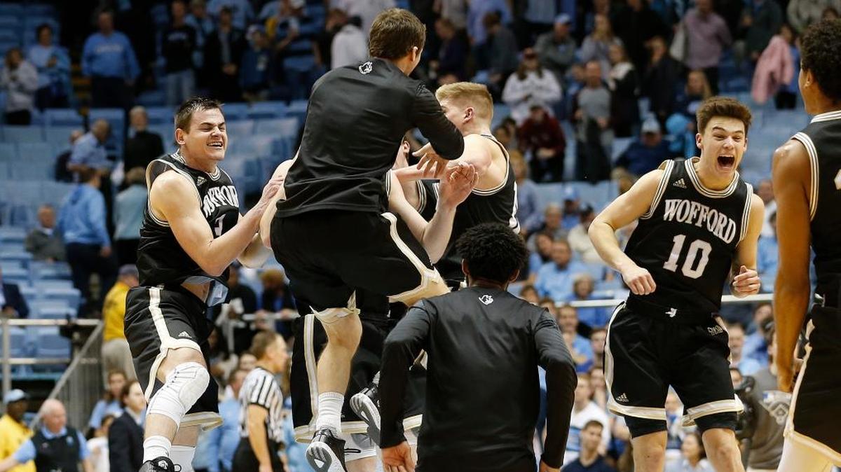 Wofford players including Fletcher Magee, far left, and Nathan Hoover (10) celebrate after upsetting fifth-ranked North Carolina 79-75 an NCAA college basketball game in Chapel Hill, N.C., Wednesday, Dec. 20, 2017. It was Wofford’s first win over an AP Top 25 team in program history.