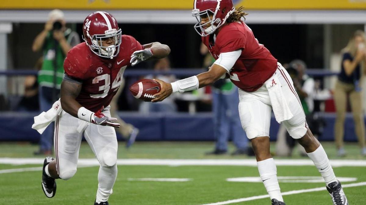 Alabama quarterback Jalen Hurts, right, hands off to running back Damien Harris during the first half of the Crimson Tide’s 52-6 win over Southern California on Saturday, Sept. 3, 2016, in Arlington, Texas. Despite rushing for 1,037 yards last season, Harris may not be Alabama’s No. 1 running back in 2017.