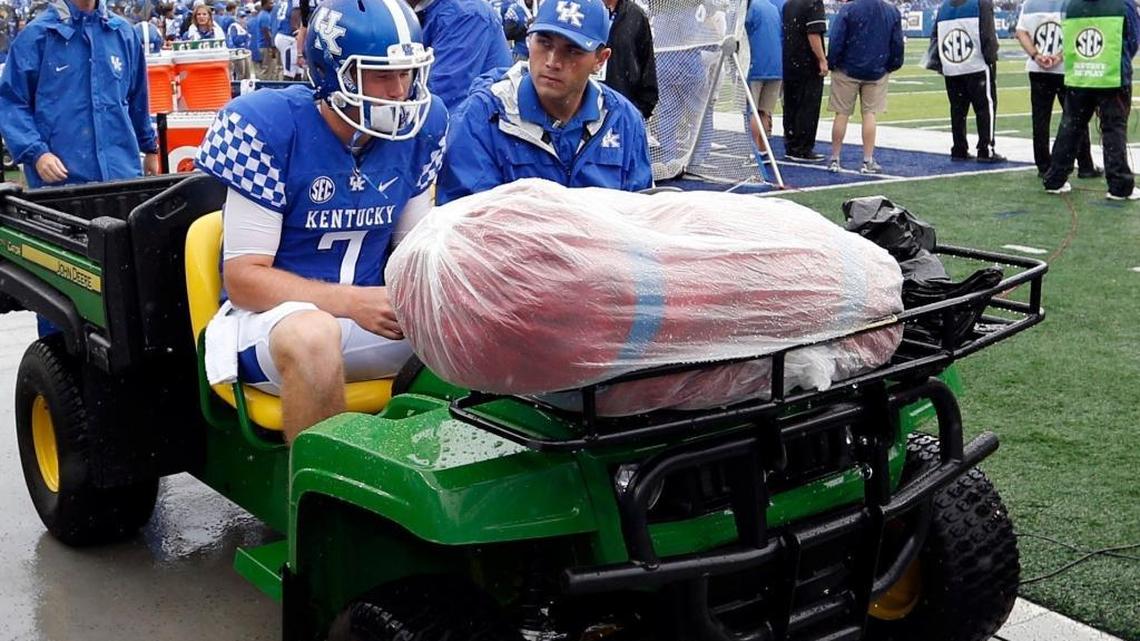 Kentucky quarterback Drew Barker (7) was taken off the field after being injured in the first series during UK’s 62-42 win over New Mexico State at Commonwealth Stadium in Lexington, Ky., Saturday, September 17, 2016.