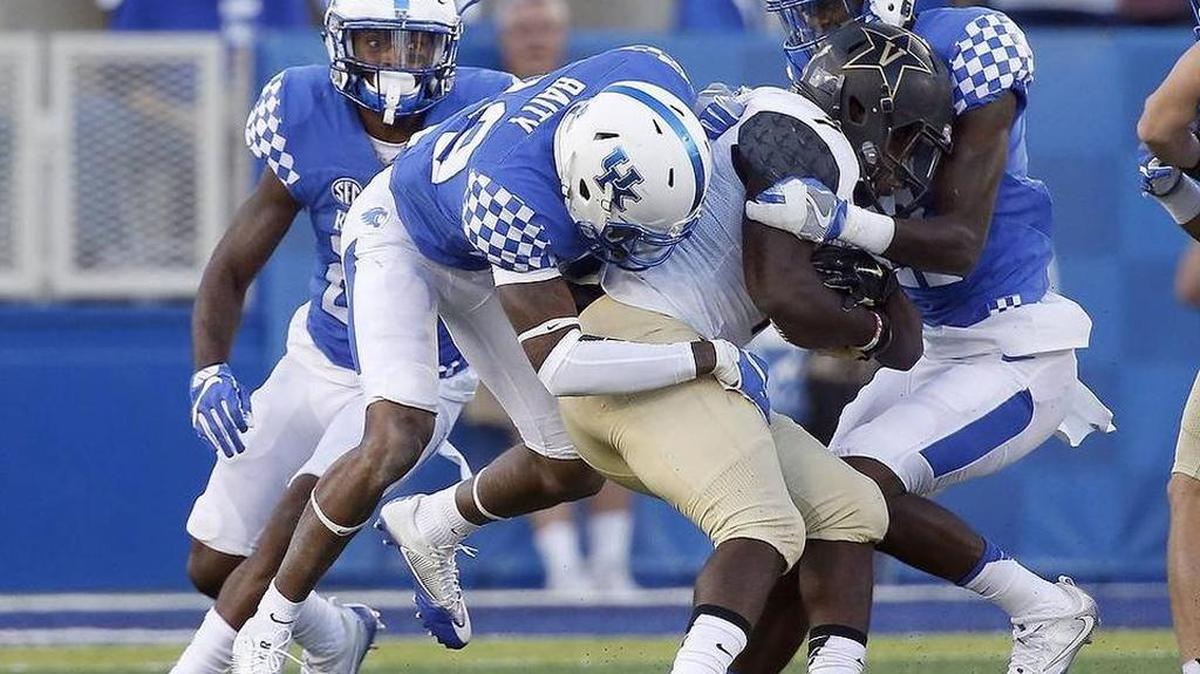 Kentucky cornerbacks Derrick Baity (29) Chris Westry (21) combined to tackle Vanderbilt Commodores running back Ralph Webb (7) during UK’s 20-13 win over Vandy on Oct. 8, 2016 at Commonwealth Stadium.