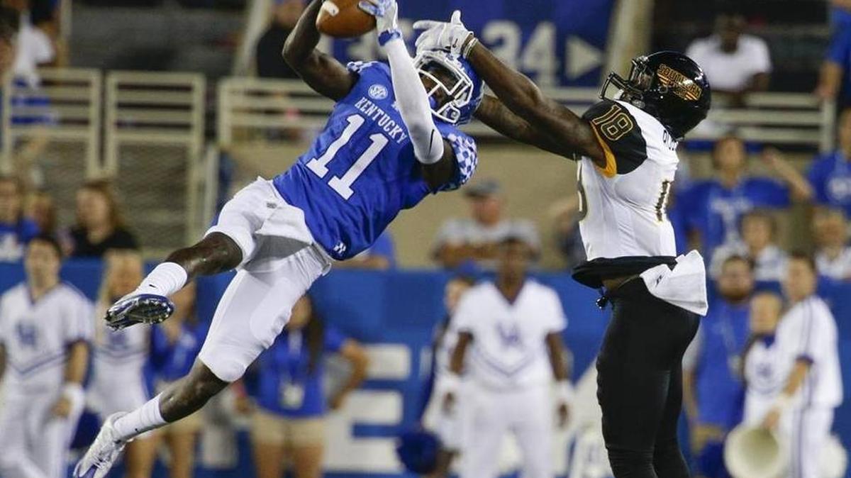 Kentucky defensive back J.D. Harmon intercepts a Southern Miss pass during last Saturday’s game at Commonwealth Stadium.