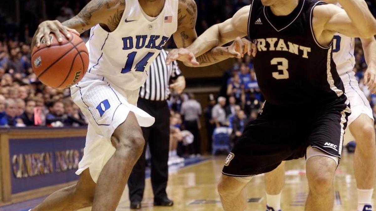Duke's Brandon Ingram (14) dribbles as Bryant's Bosko Kostur (3) defends during the first half of an NCAA college basketball game in Durham, N.C. on Saturday.