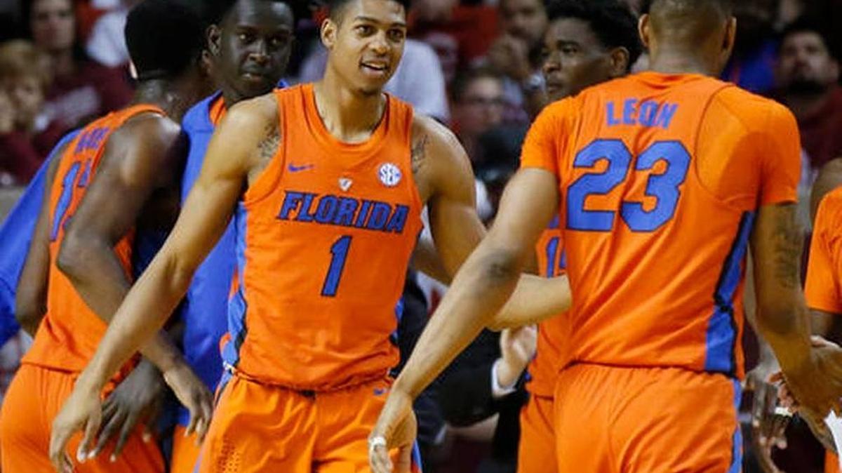 Florida forward Devin Robinson (1) greets teammate Justin Leon (23) as he returns to the bench during the Gators’ 84-52 win over Oklahoma in Norman, Okla., Saturday, Jan. 28, 2017.