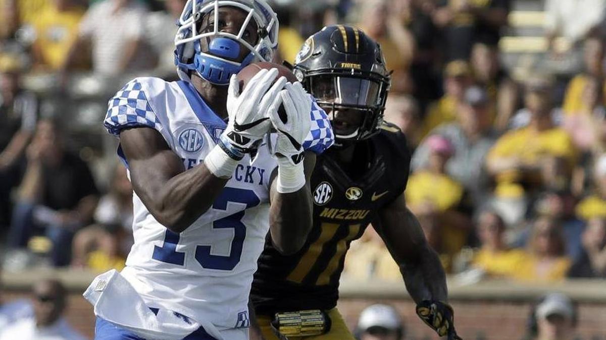 Kentucky receiver Jeff Badet catches a 65-yard touchdown pass from quarterback Stephen Johnson in UK’s 35-21 win at Missouri on Oct. 29, 2016.