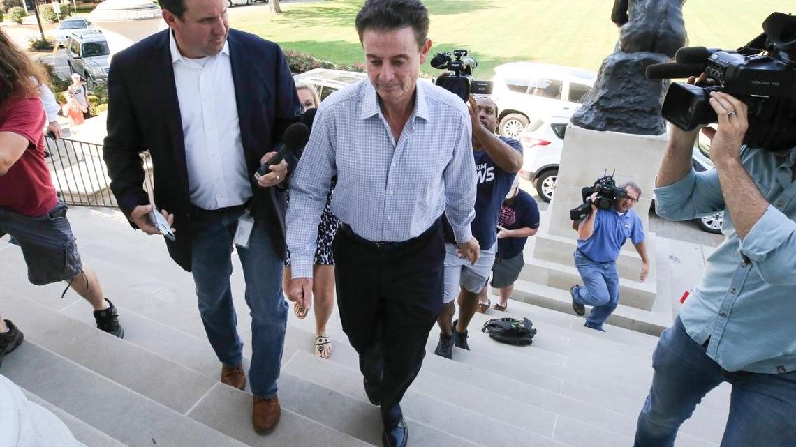 Louisville men’s basketball coach Rick Pitino arrived at Grawemeyer Hall on Wednesday for a meeting with the university’s interim president, Greg Postel. Louisville announced Wednesday that it has placed Pitino and Athletics Director Tom Jurich on administrative leave amid a federal bribery investigation.