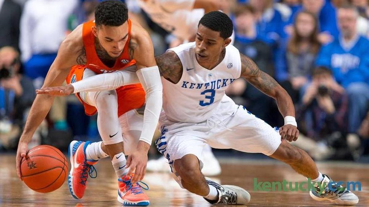 Kentucky guard Tyler Ulis, right, extends for a steal against Florida guard Chris Chiozza in the first half. The University of Kentucky hosted the University of Florida, Saturday, Feb. 06, 2016 at Rupp Arena in Lexington.