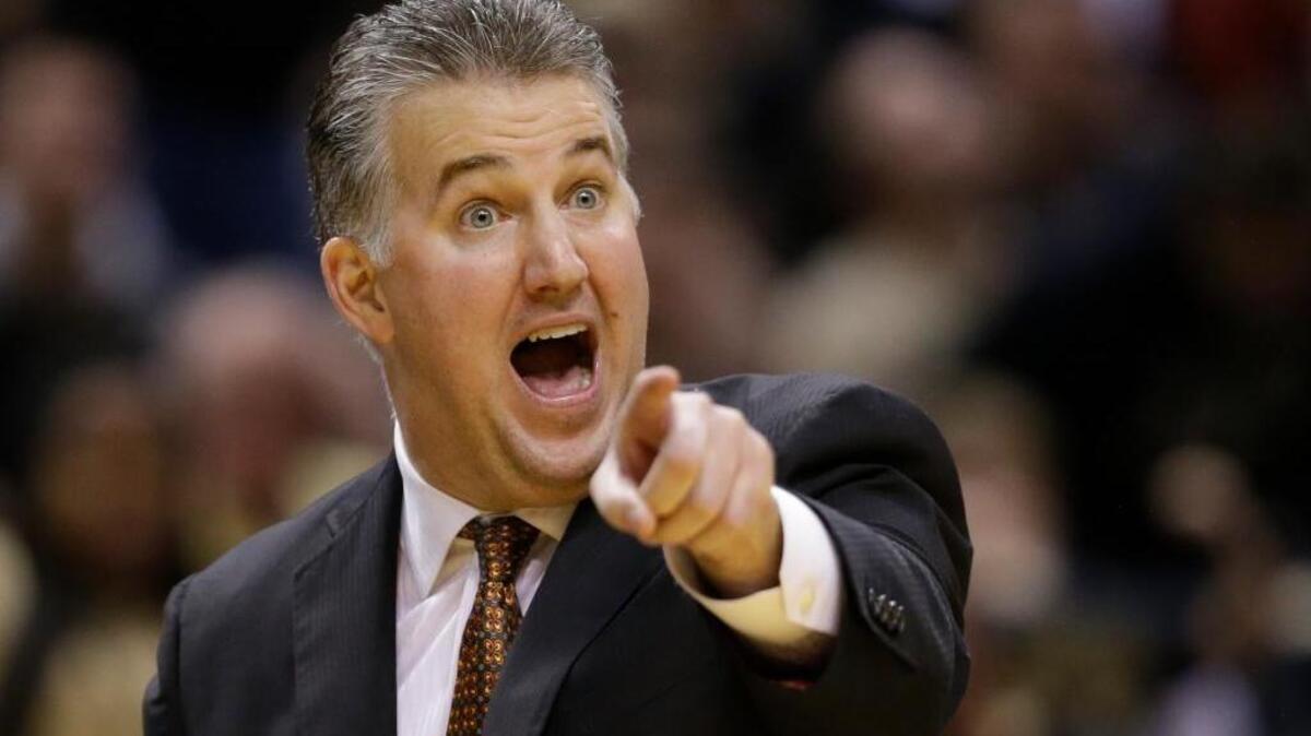 Purdue head coach Matt Painter questions a call in the second half of an NCAA college basketball game against Butler in Indianapolis, Saturday, Dec. 19, 2015. Butler defeated Purdue 74-68.