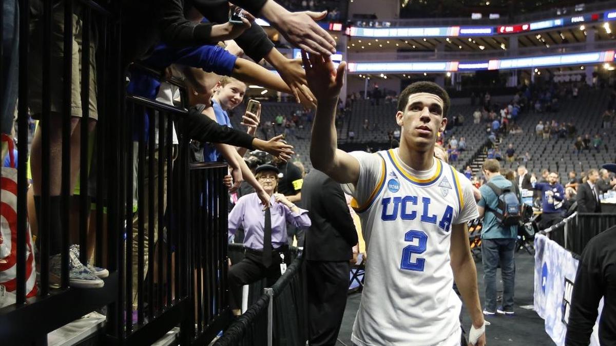 UCLA guard Lonzo Ball slaps hands as he walks to the locker room after UCLA defeated Cincinnati 79-67 in a second-round game of the men’s NCAA Tournament in Sacramento, Calif., Sunday, March 19, 2017.