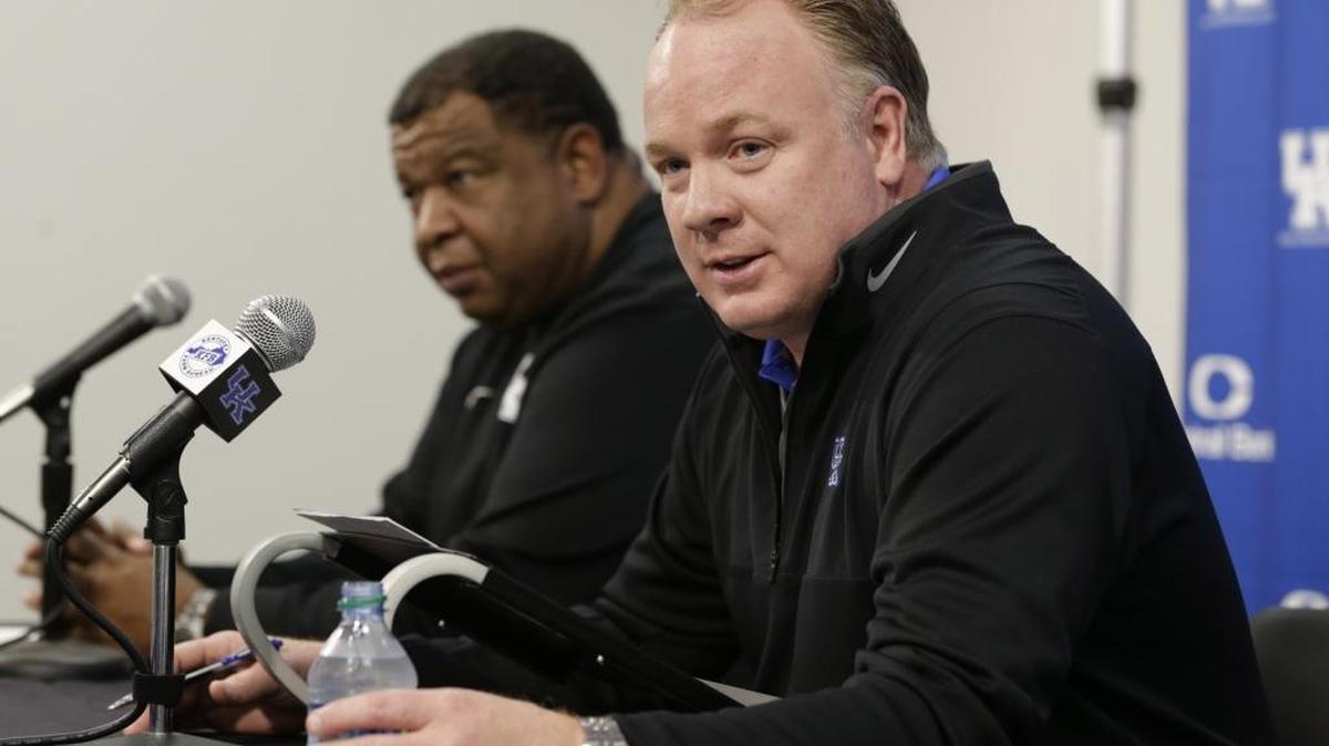 Kentucky head coach Mark Stoops with Vince Marrow at left discussed this season’s signed recruits during a press event at Commonwealth Stadium in Lexington, Ky, on Feb. 3, 2016. A poll of SEC sports information directors picked UK to finish sixth in the East this season.