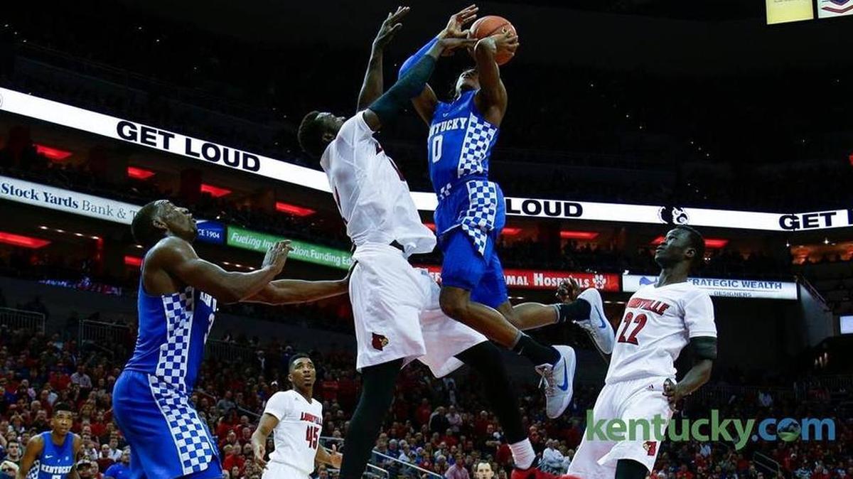 Kentucky guard De'Aaron Fox (0) drew contact on a drive during UK’s 73-70 loss to Louisville at the KFC Yum Center in Louisville.