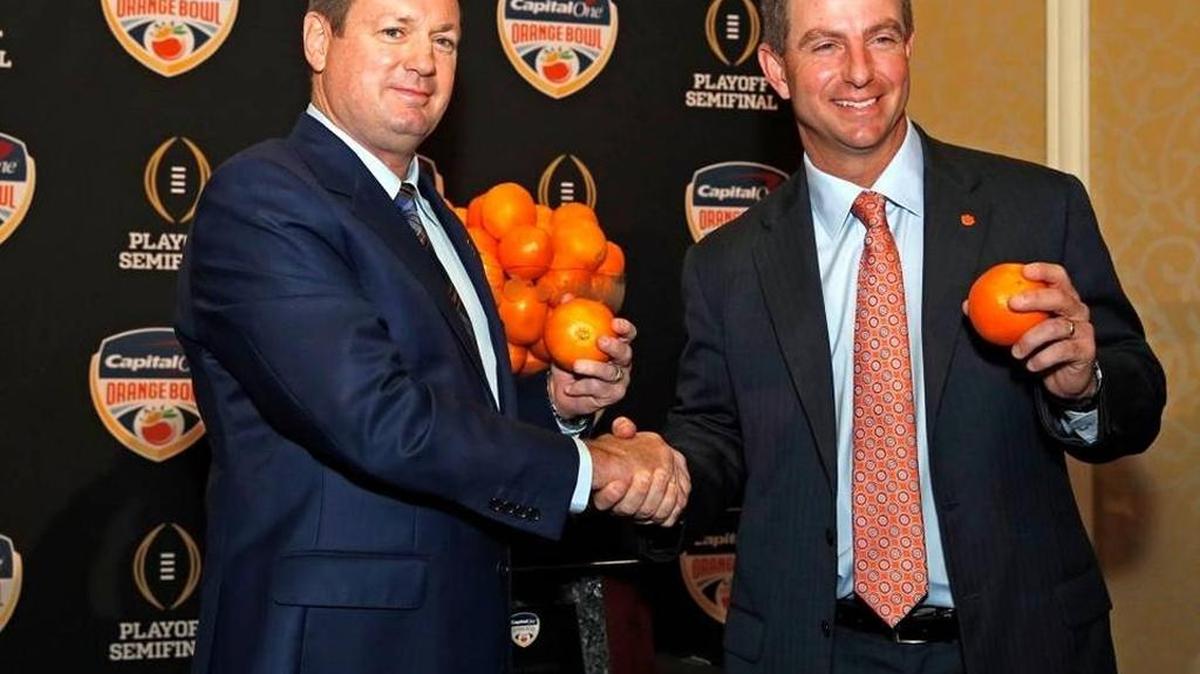 Oklahoma Sooners head coach Bob Stoops, left, and Clemson head coach Dabo Sweeney during the Orange Bowl press conference at the Renaissance Hotel in Fort Lauderdale on Wednesday, December 30, 2015.