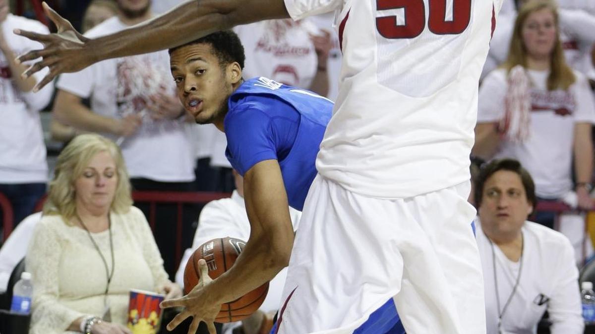 Kentucky Wildcats forward Skal Labissiere (1) looking to pass as he is pressured by Arkansas Razorbacks center Willy Kouassi (50) as Kentucky played Arkansas on Thursday January 21, 2016 in Fayetteville, AR.