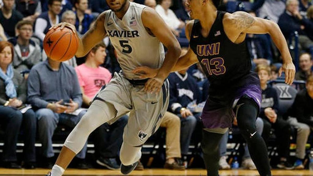 Xavier guard Trevon Bluiett (5) drives against Northern Iowa guard Juwan McCloud (13) during a 64-42 Xavier win on Saturday, Nov. 26, 2016, in Cincinnati.