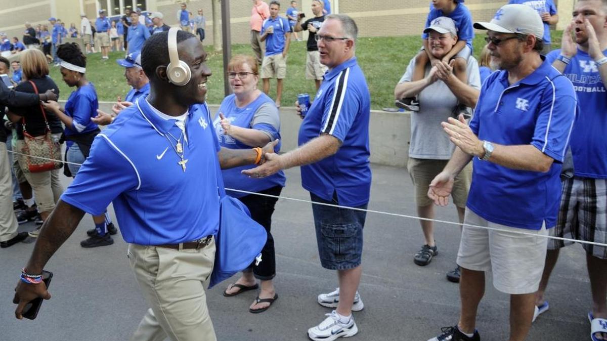 Kentucky running back Boom Williams is greeted by fans during the Cat Walk prior to the University of Kentucky-South Carolina football game at Commonwealth Stadium on Saturday, Sept. 24, 2016.