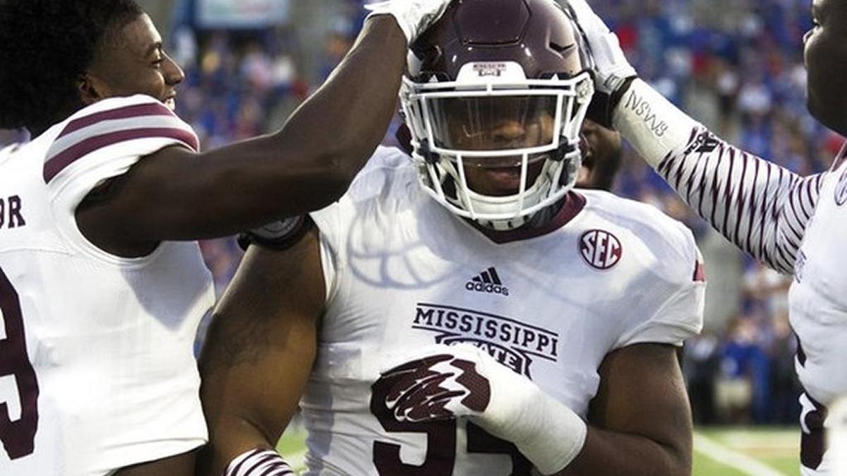 Mississippi State players congratulate defensive lineman Jeffery Simmons as he returns to the sideline after scoring a touchdown against Louisiana Tech in Ruston, La., Saturday, Sept. 9, 2017.