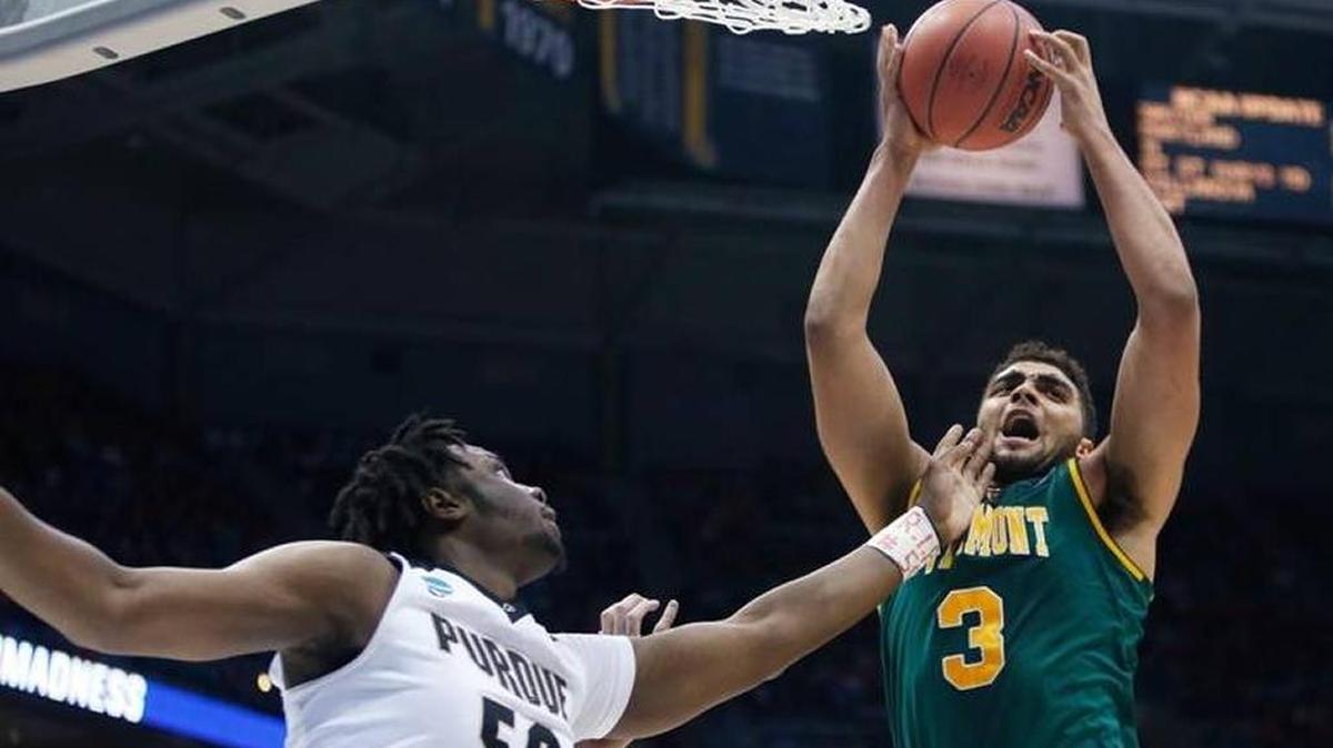 Vermont’s Anthony Lamb grabbed a rebound in front of Purdue's Caleb Swanigan during his team’s 80-70 loss to the Boilermakers in the NCAA Tournament last year in Milwaukee, Wis., last season.