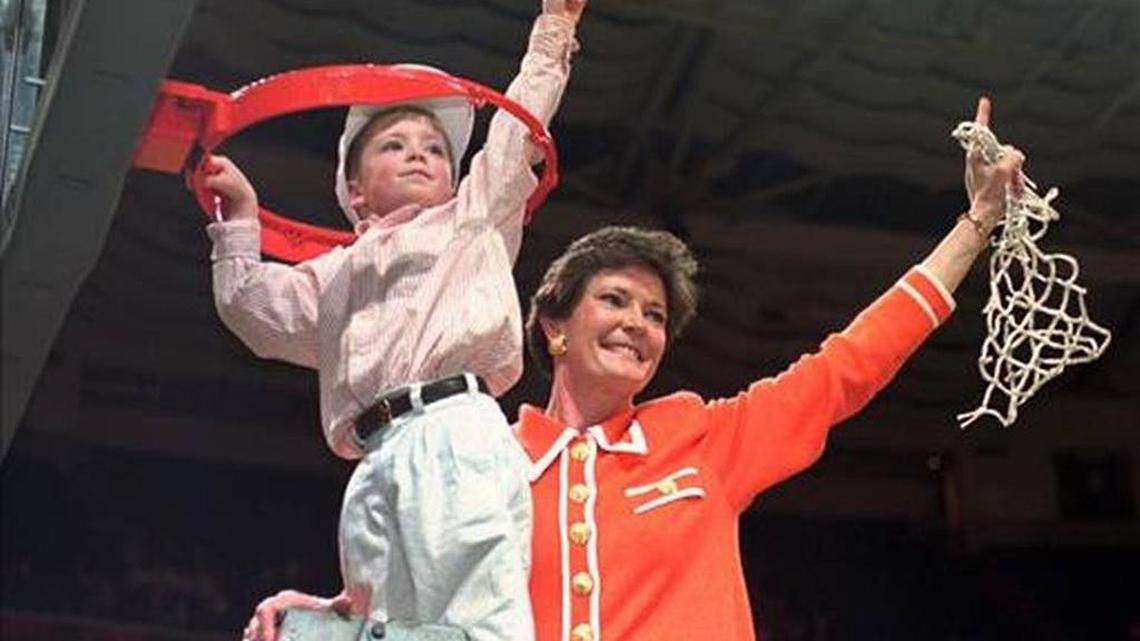 Tennessee coach Pat Summitt and son Tyler, take down the net after Tennessee defeated Georgia 83-65 in the 1996 title game at the NCAA women's basketball Final Four at Charlotte Coliseum in Charlotte, N.C. Summitt, the winningest coach in Division I college basketball history who uplifted the women's game from obscurity to national prominence during her career at Tennessee, died Tuesday morning, June 28, 2016. She was 64.