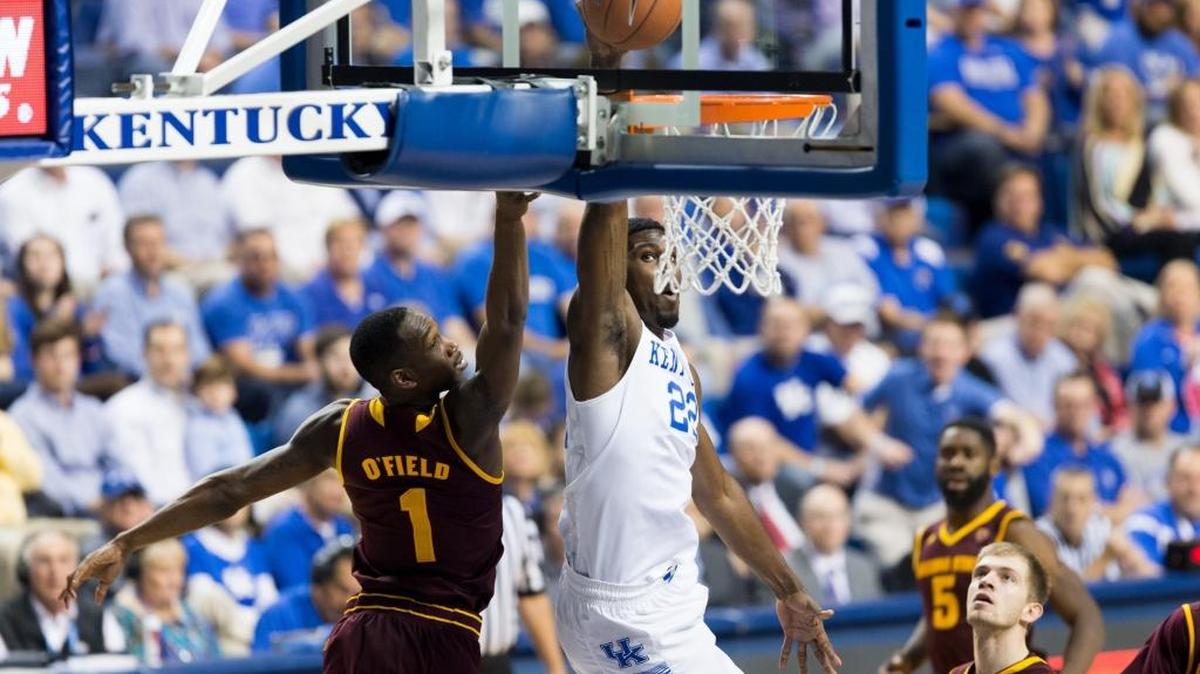 Kentucky forward Alex Poythress, center, dunks over Arizona State guard Maurice O'Field in the first half and drew the foul. The University of Kentucky hosted Arizona State University, Saturday, Dec. 12, 2015 at Rupp Arena in Lexington .