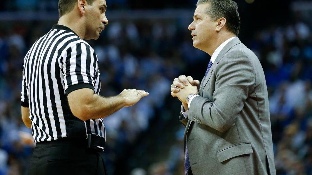 Kentucky head coach John Calipari talked with an official during UK’s win over UCLA in the NCAA South Region semifinals at FedExForum in Memphis, Tn., Friday, March 24, 2017. Calipari has denied reports that he has interest in being team president of the NBA’s New York Knicks.