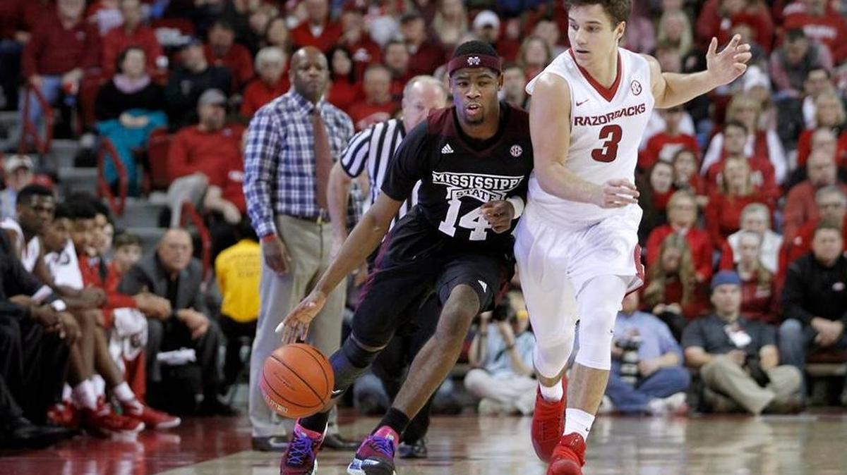 Arkansas’ Dusty Hannahs (3) keeps close to Mississippi State’s Malik Newman (14) during the second half of an NCAA college basketball game Saturday, Jan. 9, 2016, in Fayetteville, Ark. Arkansas beat Mississippi State 82-68.