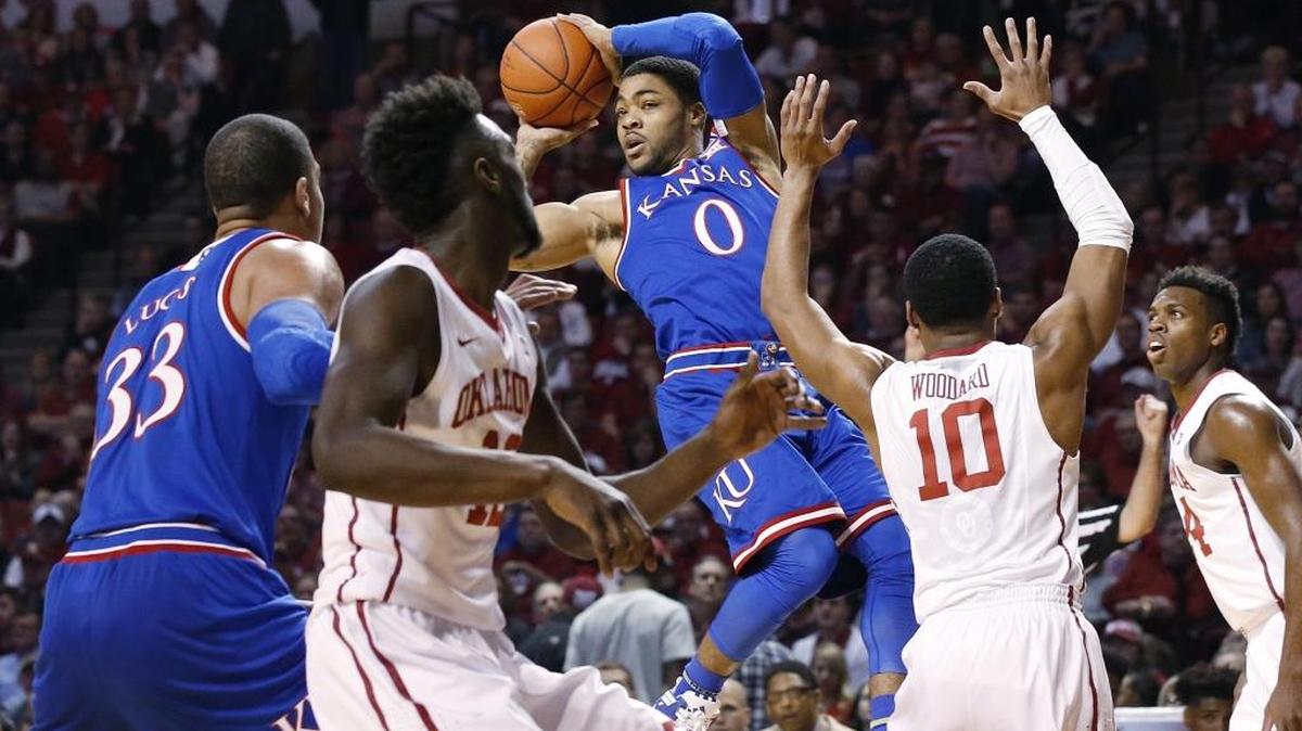 Kansas guard Frank Mason III (0) looks to pass in the first half of an NCAA college basketball game against Oklahoma in Norman, Okla., Saturday, Feb. 13, 2016.