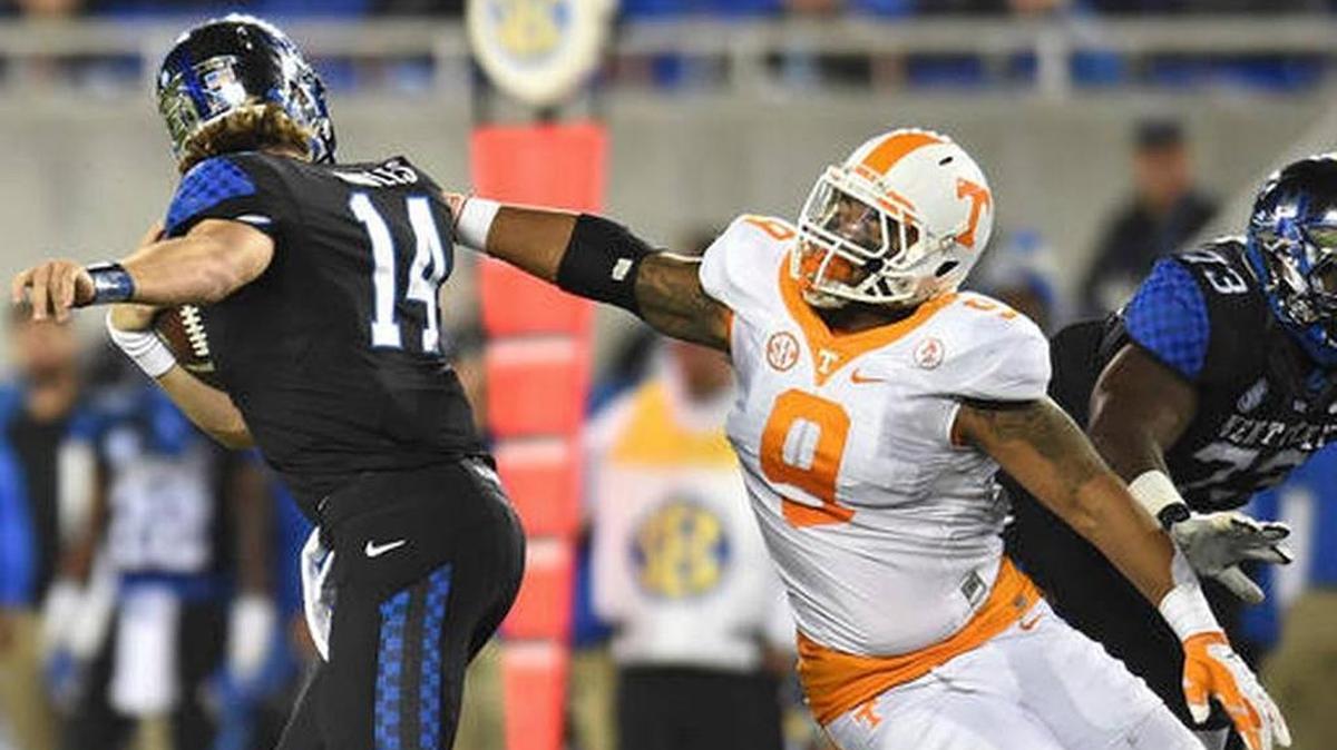 In this Oct. 31, 2015, file photo, Tennessee defensive end Derek Barnett sacks Kentucky quarterback Patrick Towles, left, during Tennessee’s win over Kentucky last year. Barnett leads the unbeaten Vols against No. 8 Texas A&M in College Station on Saturday.