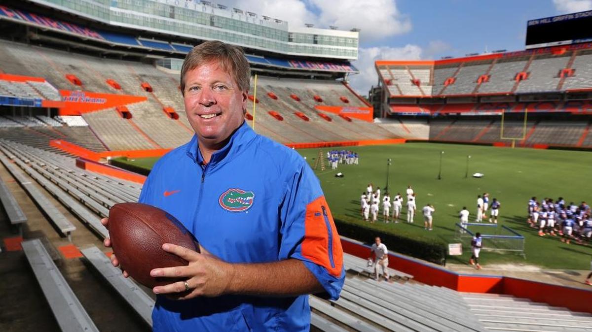 In this Aug. 9, 2015 file photo, Jim McElwain, then the new head football coach at the University of Florida, poses during a photo shoot with the Orlando Sentinel, at Ben Hill Griffin Stadium in Gainesville, Fla. McElwain and the Gators are parting ways after Florida's 42-7 blowout loss to Georgia on Saturday, according to media reports.