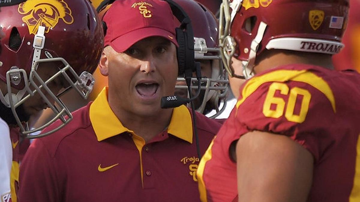 Southern Cal coach Clay Helton will lead the Trojans against defending national champion Alabama in Arlington, Texas on the opening weekend of college football.