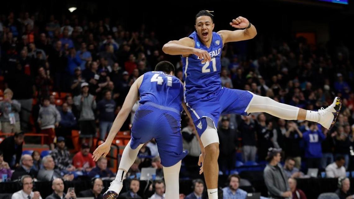 Buffalo’s Dominic Johnson, right, and Brock Bertram celebrate after Buffalo upset Arizona 89-68 in first-round game in the NCAA men’s college basketball tournament Thursday, March 15, 2018, in Boise, Idaho. Buffalo plays No. 5 seed Kentucky on Saturday.