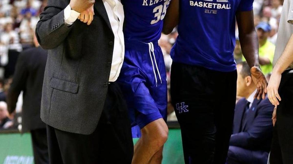 Kentucky forward Derek Willis (35) was helped off court after an injury in the second half and overtime of the Kentucky at Texas A&M mens basketball game at Reed Arena in College Station, Texas, on Feb. 20, 2016. The Aggies beat UK 79-77 in overtime.
