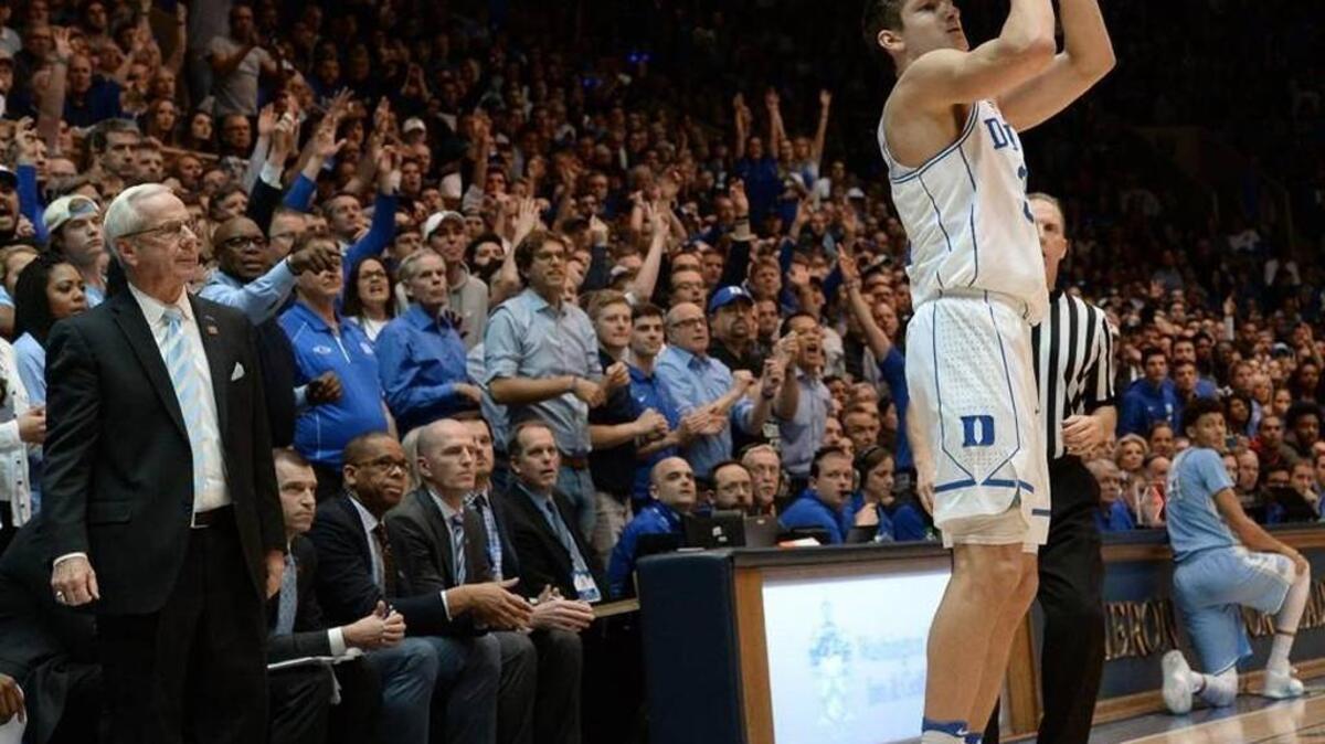 North Carolina coach Roy Williams watches Duke guard Grayson Allen (3) shoots a three-pointer in the Blue Devils’ 86-78 win over the Tar Heels on Feb. 9.