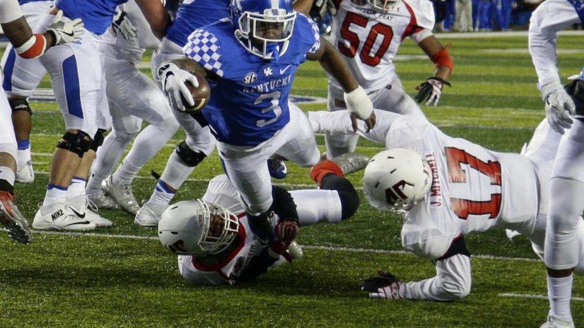 Kentucky running back Jojo Kemp (3) stretched over the goal line for a fourth quarter touchdown as Kentucky defeated Austin Peay 49-13 on Saturday November 18, 2016 in Lexington, Ky.