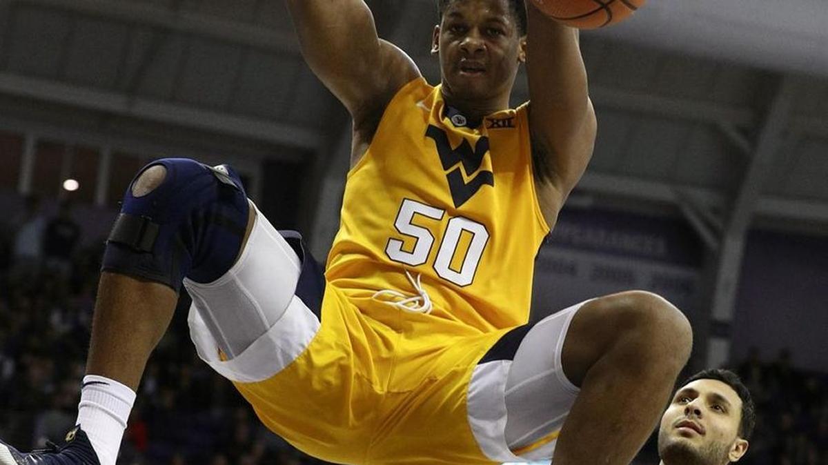West Virginia forward Sagaba Konate (50) dunks over TCU forward Ahmed Hamdy-Mohamed (23) in the first half of WVU’s 82-73 loss to the Horned Frogs in an NCAA college basketball game in Fort Worth, Texas, Monday, Jan. 22, 2018.