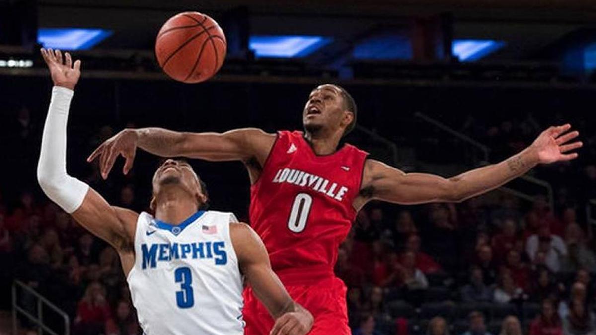 Louisville forward V.J. King (0) knocks the ball way from Memphis guard Jeremiah Martin during the Cards’ 81-72 win over Memphis at Madison Square Garden in New York on Saturday, Dec. 16, 2017.