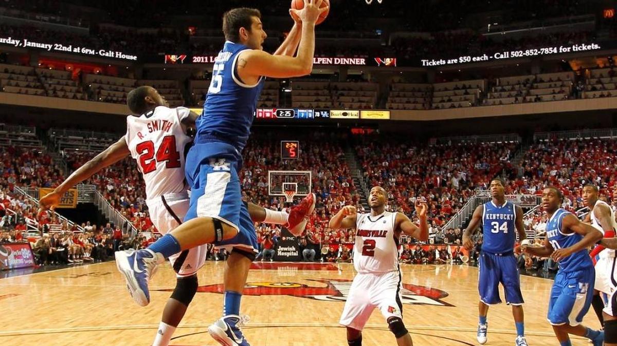 Kentucky’s Josh Harrellson grabs one of his 14 rebounds in his team’s 78-63 win at Louisville in a college basketball game on Dec. 31, 2010 at the KFC Yum Center in Louisville, KY.