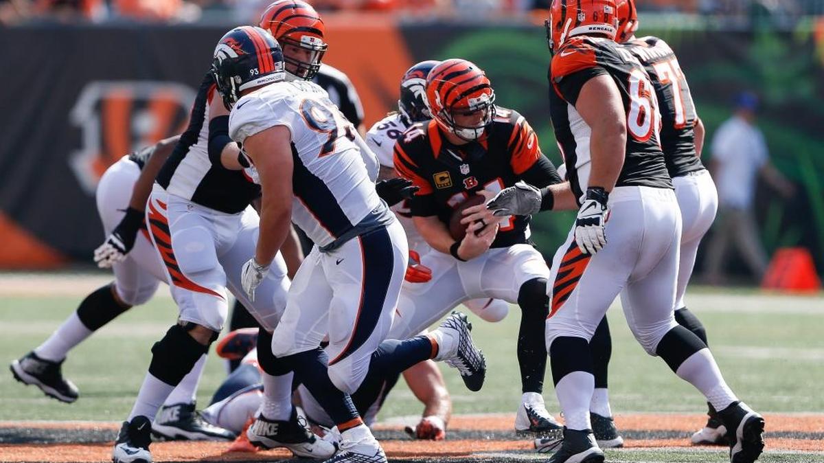 Cincinnati Bengals quarterback Andy Dalton, center, is sacked by Denver Broncos linebacker Shane Ray, behind, during the second half of the Bengals’ 29-17 loss to the Broncos on Sunday, Sept. 25, 2016, in Cincinnati.