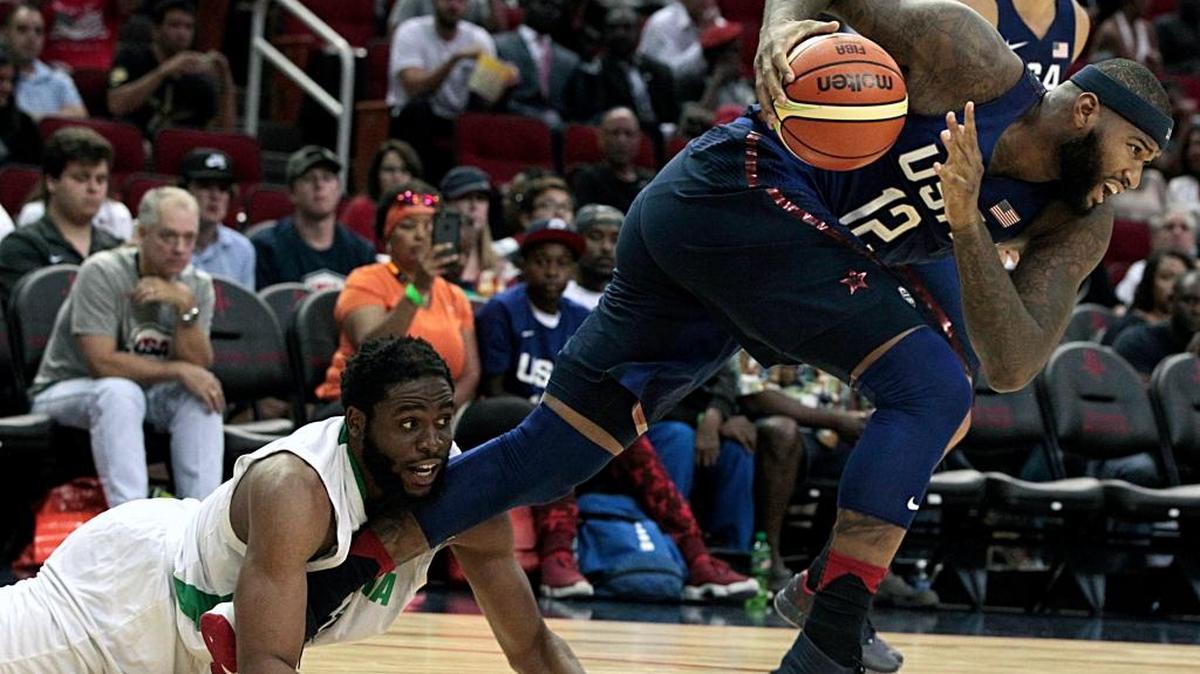 USA’s DeMarcus Cousins, right, breaks away from the Nigeria’s Ike Diogu during an exhibition basketball game Monday, Aug. 1, 2016, in Houston.