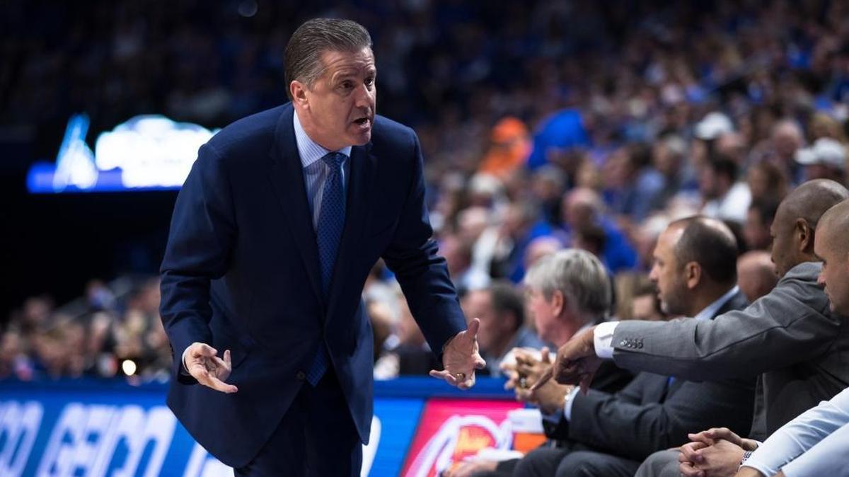 Kentucky head coach John Calipari talks to players on the UK bench during his team’s 66-64 loss to Florida in Rupp Arena on Saturday Jan. 20, 2018 in Lexington, Ky.