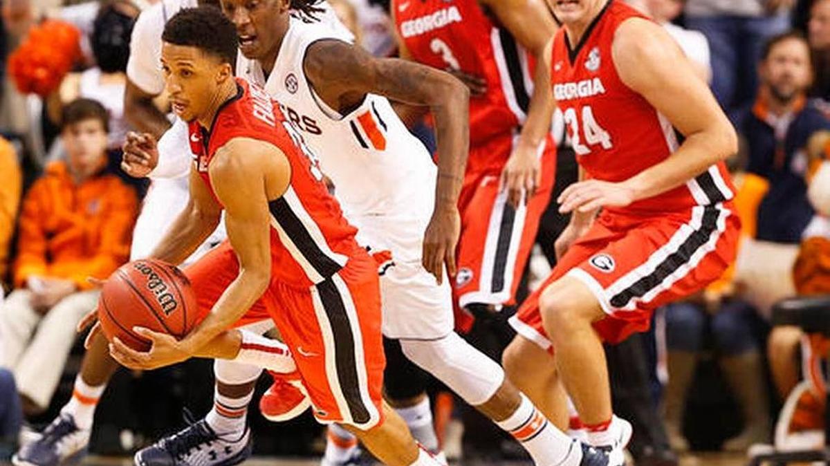 Georgia guard J.J. Frazier drives the ball to the basket against Auburn guard T.J. Dunans during the first half of the Bulldogs’ road win on Thursday, Dec. 29, 2016, in Auburn, Ala.