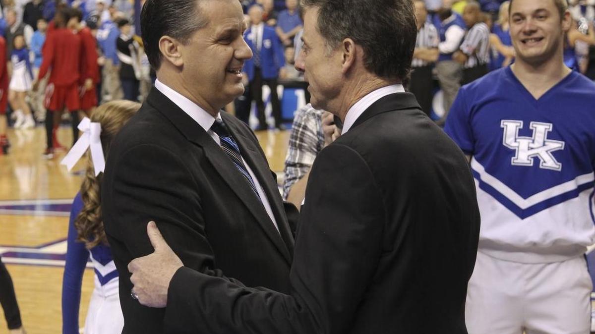 Kentucky Wildcats head coach John Calipari greeted Louisville coach Rick Pitino as Kentucky played Louisville on Saturday December 28, 2013 at Rupp Arena in Lexington.