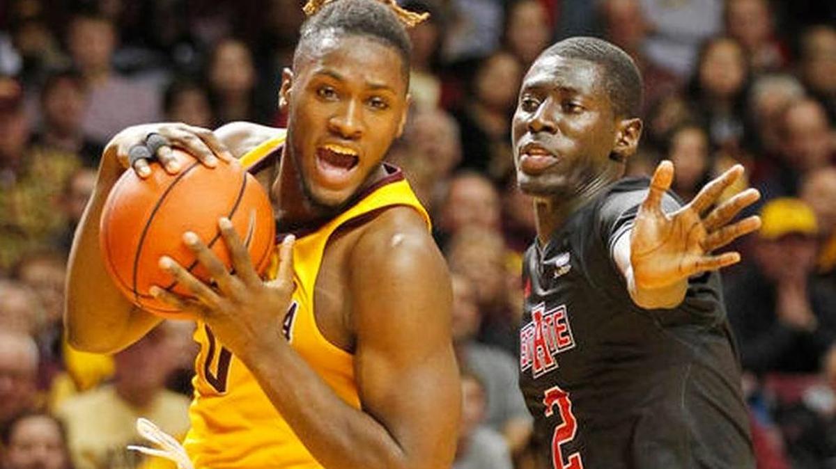 Arkansas State guard Salif Boudie (2) guards Minnesota guard Akeem Springs (0) during the first half of Minnesota’s win on Friday, Dec. 23, 2016, in Minneapolis.