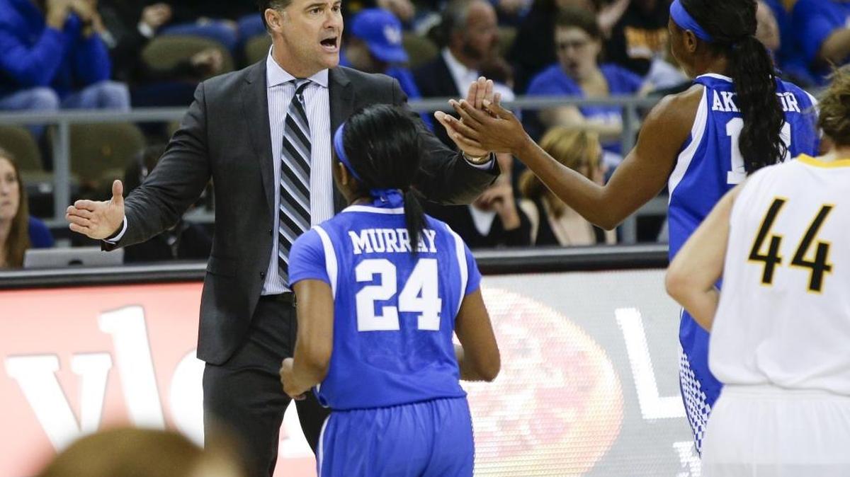 Kentucky Wildcats head coach Matthew Mitchell high fiving his team during a timeout as Kentucky defeated Northern Kentucky 84-65 on Wednesday December 2, 2015 in Highland Heights, Ky.