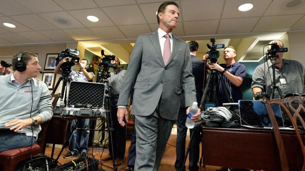 Louisville head basketball coach Rick Pitino arrives for a press conference, Thursday, Oct. 20, 2016, in Louisville, Ky. The NCAA accused Louisville of four violations stemming from its investigation into allegations that a former basketball staffer hired escorts and strippers for sex parties with recruits and players.