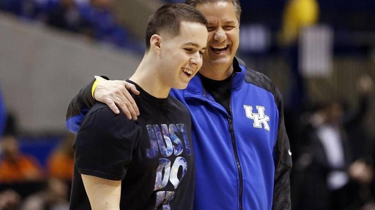 Kentucky head coach John Calipari hugged his son Brad as UK practiced in Lucas Oil Stadium in Indianapolis in March 2014.