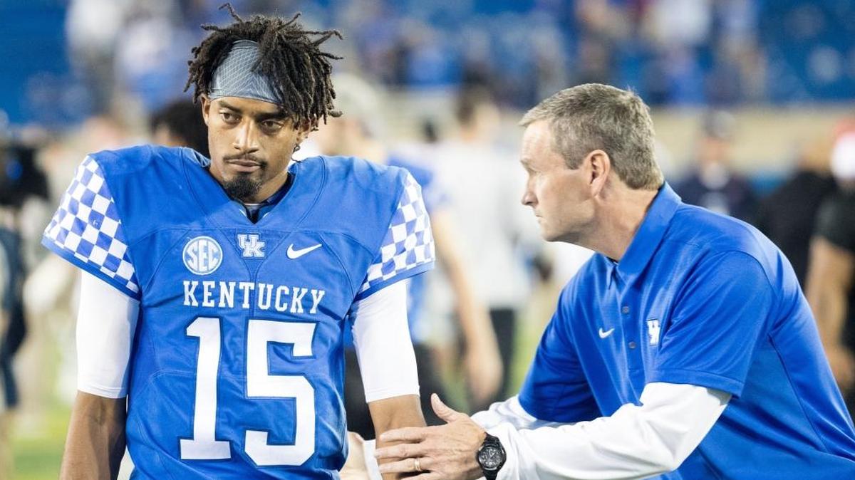 Kentucky quarterback Stephen Johnson (15) is consoled by Athletics Director Mitch Barnhart after UK’s last-second 37-34 loss to Ole Miss at Kroger Field on Saturday Nov. 4, 2017 in Lexington, Ky.
