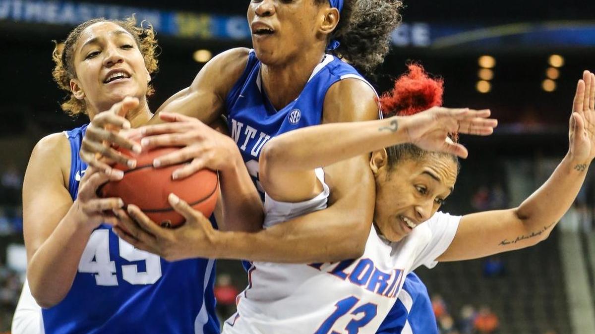 Kentucky center Alyssa Rice (45), teammate Evelyn Akhator (13) and Florida guard Cassie Peoples (13) vie for a loose ball during an NCAA college basketball game in the Southeastern Conference women’s tournament in Jacksonville, Fla., Friday, March 4, 2016.
