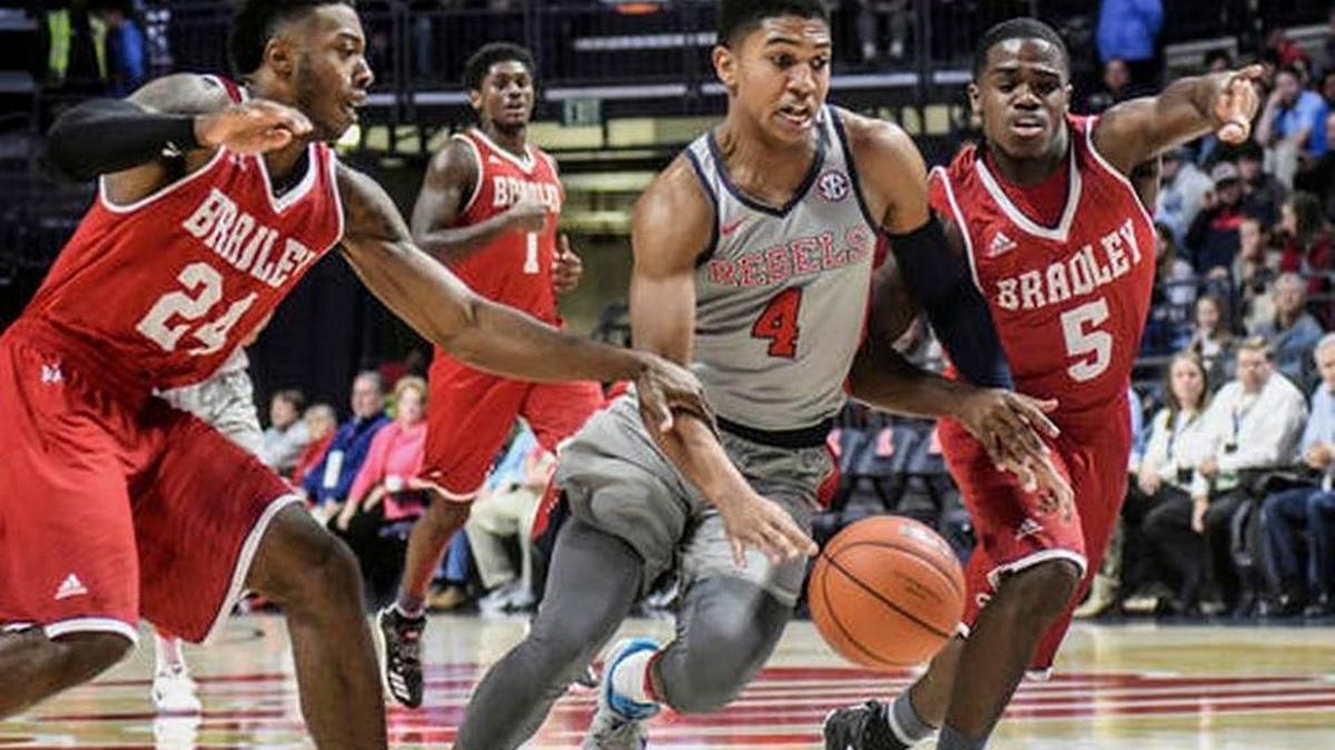 Mississippi guard Breein Tyree (4) is fouled by Bradley guard Darrell Brown (5) as he drives past guard JoJo McGlaston (24) during the Rebels’ win in Oxford, Miss., Monday, Dec. 19, 2016.