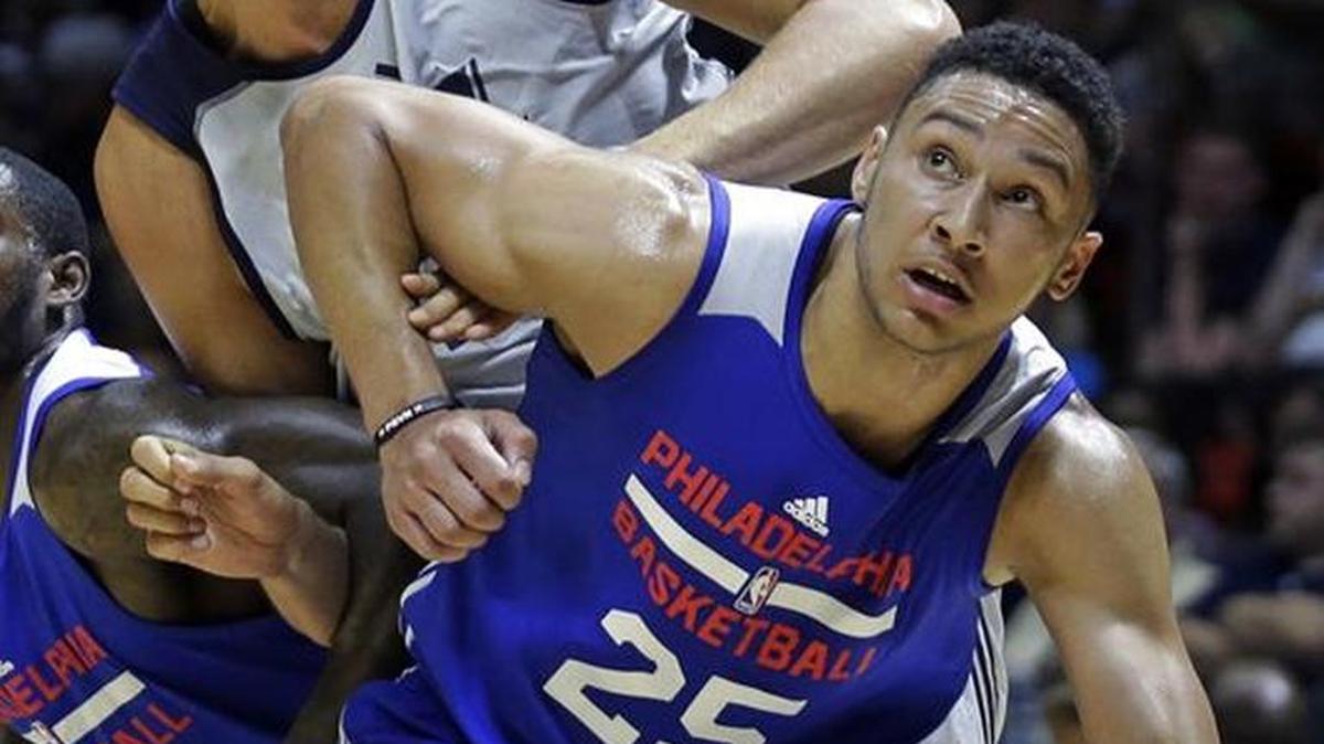 Philadelphia forward Ben Simmons (25) and Utah center Tibor Pleiss battle under the boards for a rebound during a summer league game Thursday in Salt Lake City.